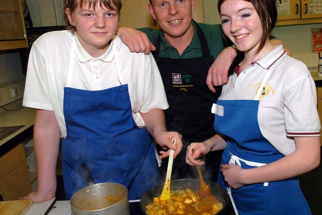 Darren and Stacey cook up a curry with Colour Sergeant Mike Beaton at Handsworth Grange School in 2006