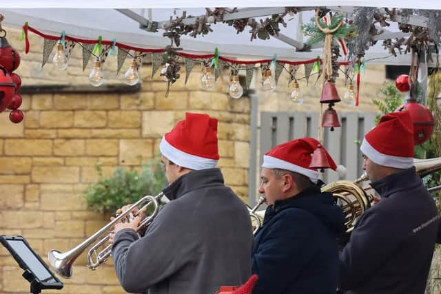 Listen to festive tunes played live at the Christmas market.