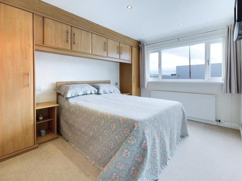uPVC double glazed window to the front elevation, fitted wardrobes and a range of fitted cupboards to one wall, ceiling coving, radiator panel and power points.