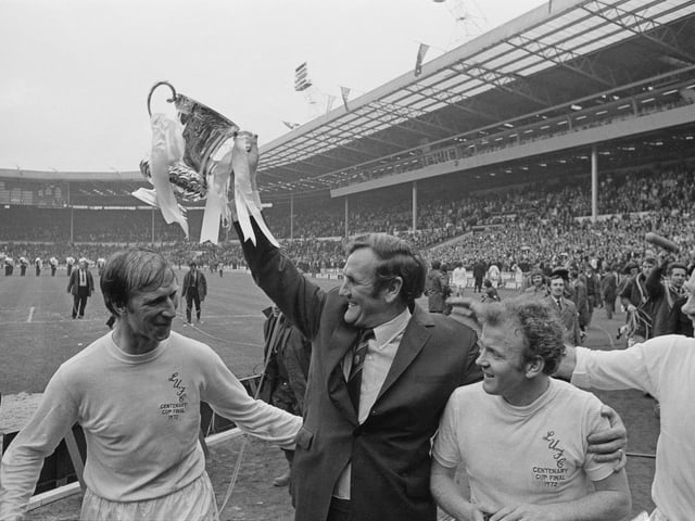 Don Revie lifts FA Cup after his players defeated Arsenal to win the final at Wembley Stadium. Also shown are Jack Charlton, Billy Bremner and Paul Reaney.