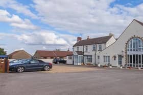 This nine-bedroom guesthouse/Airbnb with private owners' bungalow set in 6.4 acres of land has an annual turnover of £120,000.