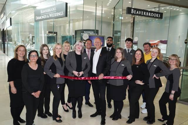 The Beaverbrooks team cut the ribbon at the unveiled Derby Store.