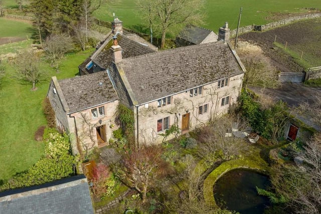 This property is a listed Grade II building which has four bedrooms, 5.18 acres of surrounding land, and a tennis court. It's priced at £1,500,000.