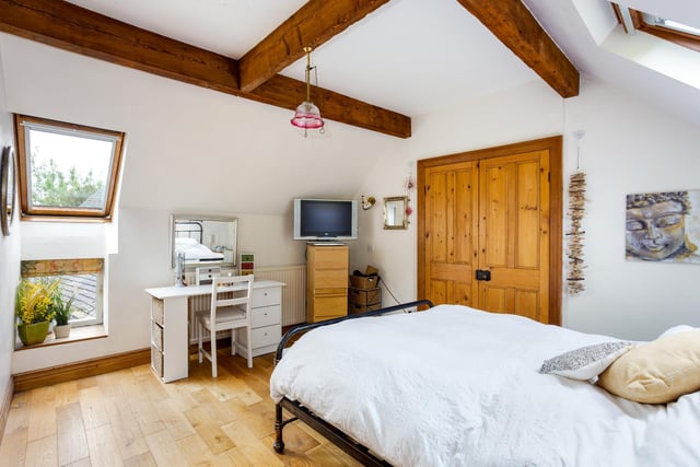The principal bedroom is complemented by an ensuite shower room. There are four double bedrooms on the upper floor of the house.
