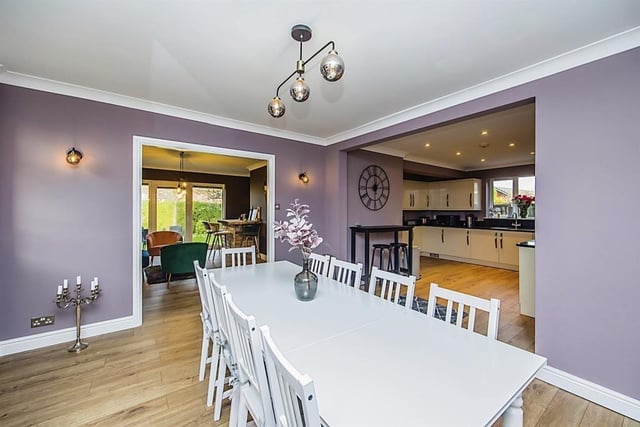The spacious kitchen at the £525,000-plus house includes this smart dining area. In the background is the bar and to the right is the kitchen.