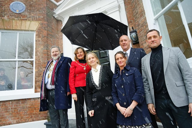Mayor of Chesterfield Councillor Mick Brady and Mayoress Councillor Suzie Perkins with Allyson and Tony Leverton, Mandi Jowitt and Marcus Leverton at the unveiling of the blue plaque at  87 New Square, Chesterfield during a snowfall.