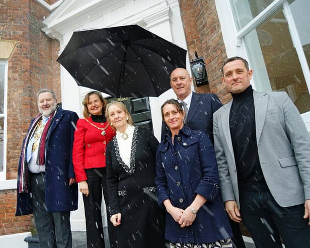 Mayor of Chesterfield Councillor Mick Brady and Mayoress Councillor Suzie Perkins with Allyson and Tony Leverton, Mandi Jowitt and Marcus Leverton at the unveiling of the blue plaque at  87 New Square, Chesterfield during a snowfall.