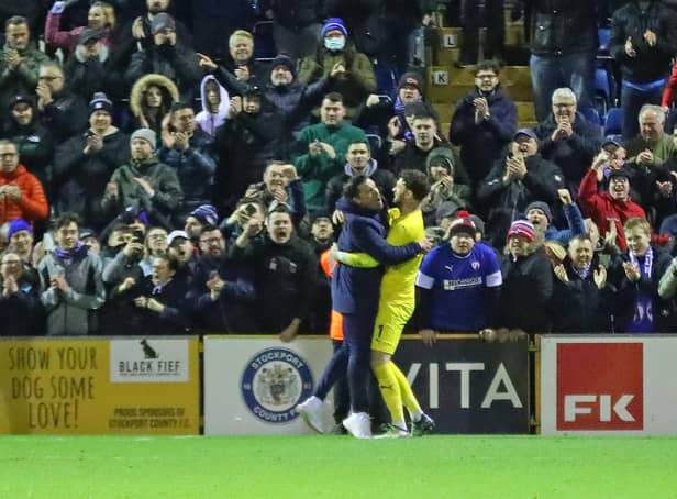 Danny Webb pictured with Scott Loach after the full-time whistle at Stockport County.