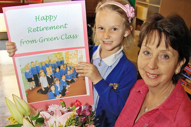 Ripley infants school teaching assistant Chris Smith retires after 26 years and is thanked by pupil Olivia Atkins.
