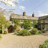 The stone-built cottage sits in a 0.17-acre plot in a conservation village that is surrounded by countryside walks.