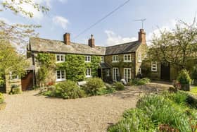 The stone-built cottage sits in a 0.17-acre plot in a conservation village that is surrounded by countryside walks.