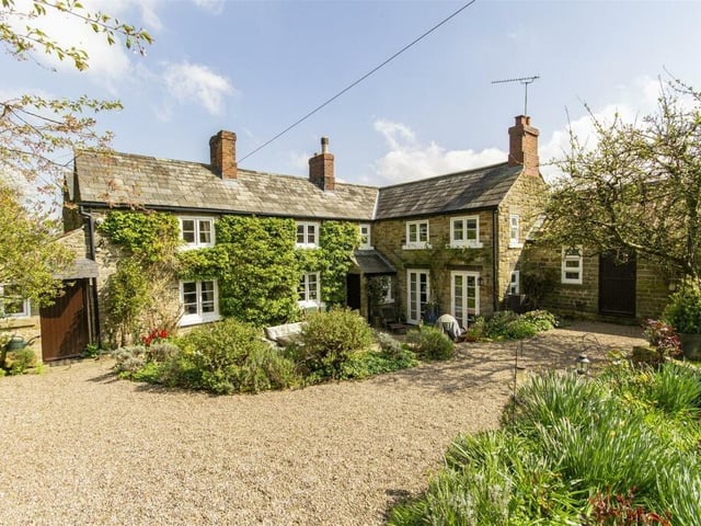 The stone-built cottage sits in a 0.17-acre plot in a conservation village that is surrounded by countryside walks.