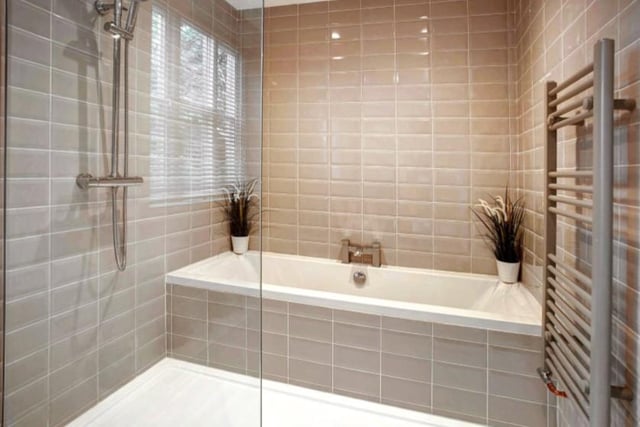 The beautifully modernised bathroom is complete with a rainfall shower and large bath. Image by Gordon Lamb/Zoopla.