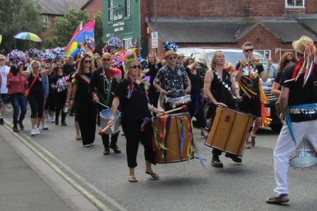 Drummers in the procession beat a path through town.