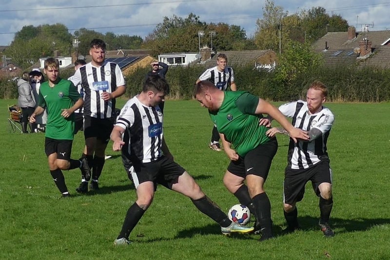 HKL Division 4 action at King George V Playing Fields Woodthorpe Inn [stripes] lose 3-1 to Creswell Barnett Res [green].