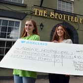 Catherine Pashley, bar manager at the Spotted Frog (centre), presents a cheque for £10,133.25 to Phoebe Marriott and Charlotte Gratton, from Ashgate Hospicecare. They money was raised by the Spotted Frog, the Butchers Arms, Galaxy Travel and Ambimedia. Picture by Brian Eyre.