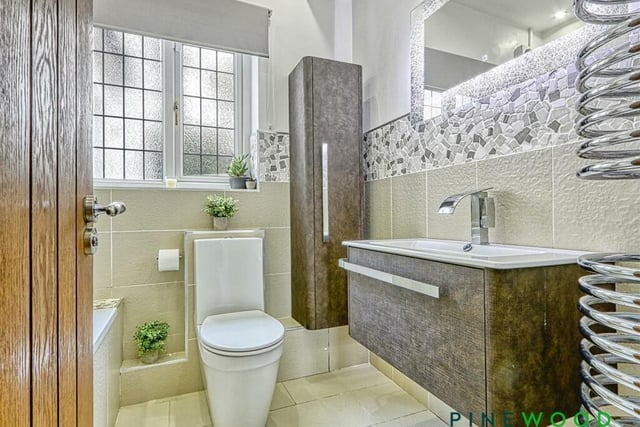 The family bathroom on the ground floor has a white suite comprising of bath with overhead rain shower, wash basin and wc.