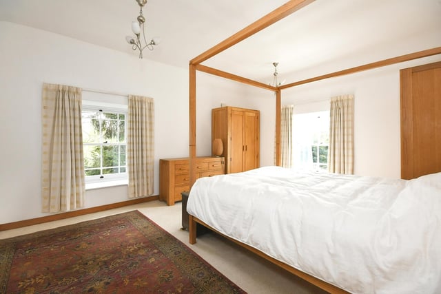 A spacious and light bedroom has plenty of floor space for free standing furniture.