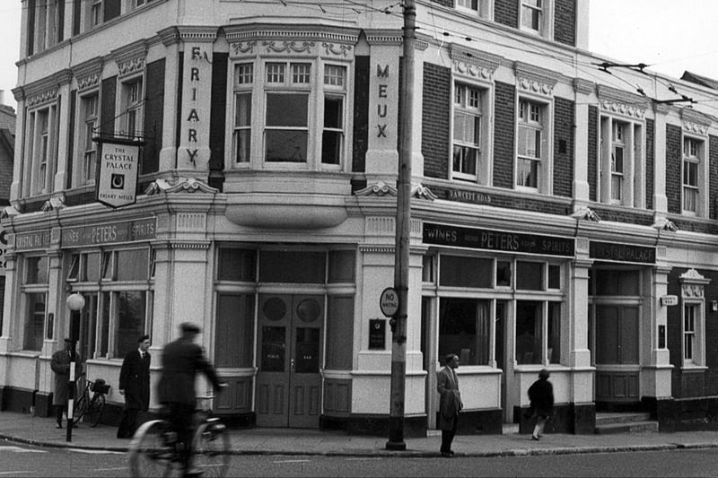 The Crystal Palace pub on the corner of Fawcett Road at Fratton Bridge
Sent in by Bill Dodd of Portchester and firstly we see many Pompey fans' favourite drinking house, the Crystal  Palace Hotel south of Fratton Bridge.
This wonderful pub was once run by former Pompey player Jock Anderson who scored a goal in the 1939 F.A. Cup Final.
The cyclist has just passed over Fratton Bridge and is heading south down Fawcett Road. The pub was another superb building demolished for road improvements.
