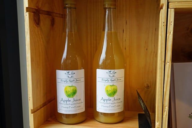 Apple juice made from fruit picked on the farm is on sale in the shop.