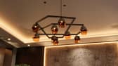 Jewel, inspired by gemstone forms with multi-faceted glass and brass detailing. Jewel Chandelier price £5,299.