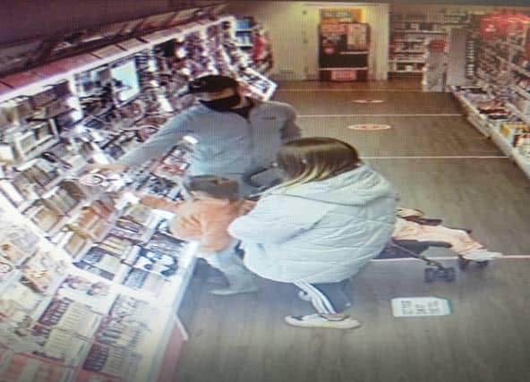 Police are hunting this couple after a £500 theft at a Matlock Superdrug store