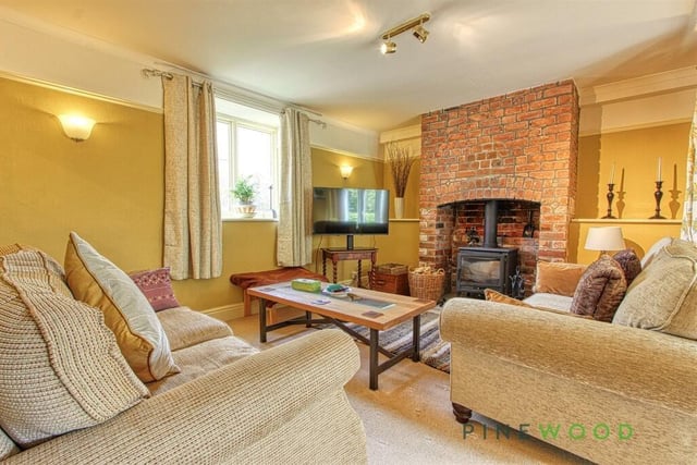 Let's begin our tour of the £725,000 Whitwell property in this lovely and spacious lounge. Your eye is instantly drawn to the traditional feature fireplace with multi-fuel burner.