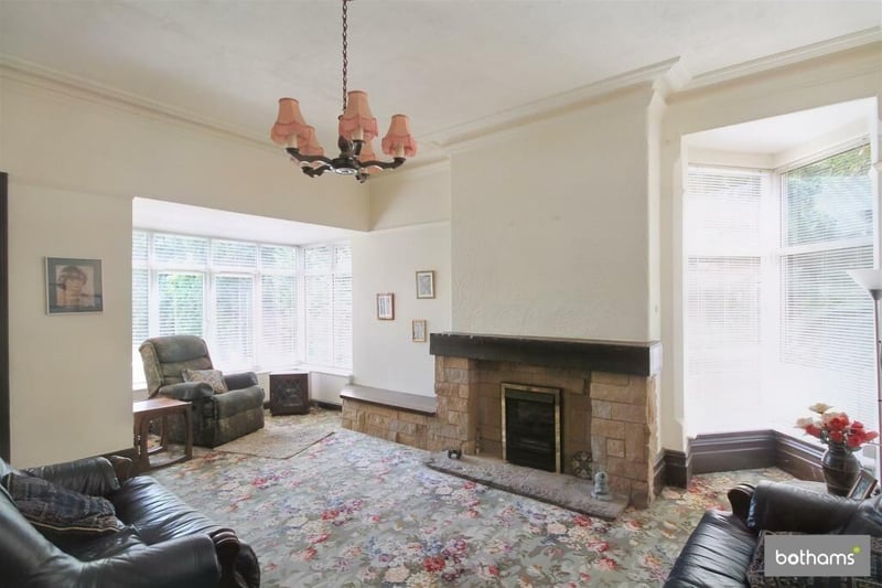 The cosy sitting room overlooks the south facing garden and is drenched in natural light.
