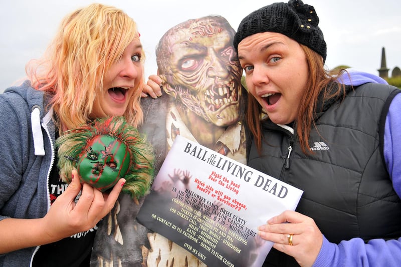 Katie Barrett (left) and Helen Hart with their Zombie heads and poster promoting The Ball of the Living Dead. Remember this from 2013?