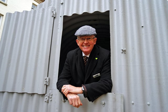 Michael Edwards from Harold Lilleker independant funeral directors seen in a Anderson shelter.