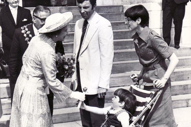 The Queen visited Chesterfield in 1977. Do you know who the little girl in our picture is?