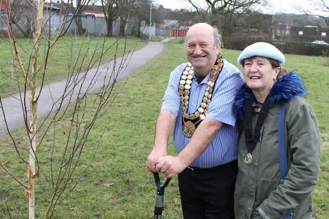 Mayor of Amber Valley, Councillor David Taylor, plants a tree, accompanied by his wife, Mayoress Valerie Taylor