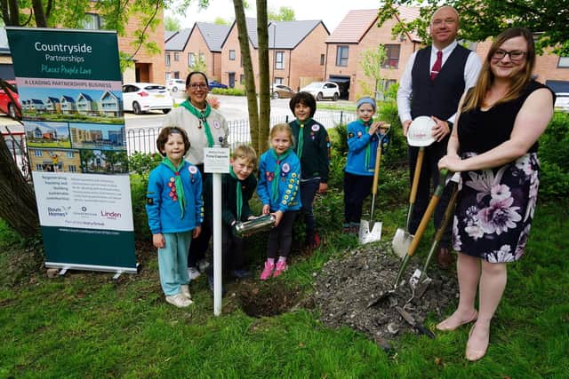 Beavers and cubs from the Second Brampton Scout group were invited, by Walton Peaks housing development, to fill and bury a time capsule. In the picture Cubs, Beavers, Bik Hughes-Jones asst beaver leader, David Tinlsy sales consultant Linden Homes and Jess Sidwell marketing manager Linden Homes.
