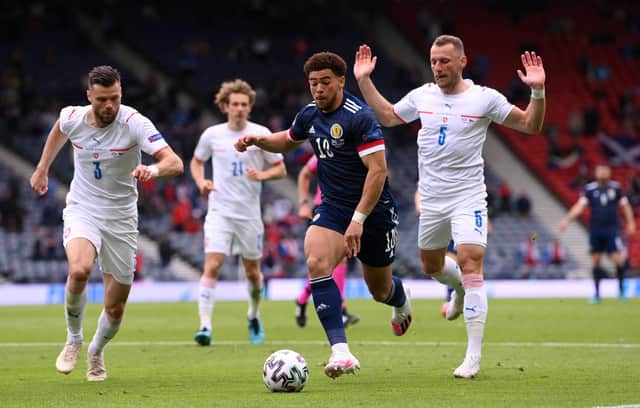Che Adams runs with the ball whilst under pressure from Ondrej Celustka and Vladimir Coufal during the UEFA Euro 2020 Championship Group D match between Scotland and Czech Republic. (Photo by Stu Forster/Getty Images)