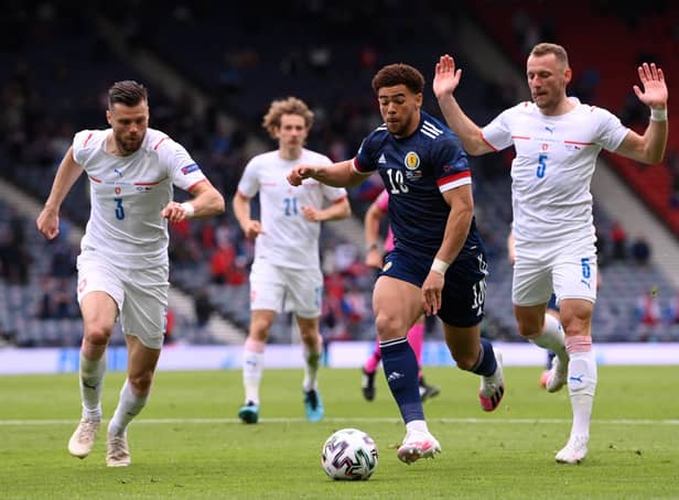 Che Adams runs with the ball whilst under pressure from Ondrej Celustka and Vladimir Coufal during the UEFA Euro 2020 Championship Group D match between Scotland and Czech Republic. (Photo by Stu Forster/Getty Images)