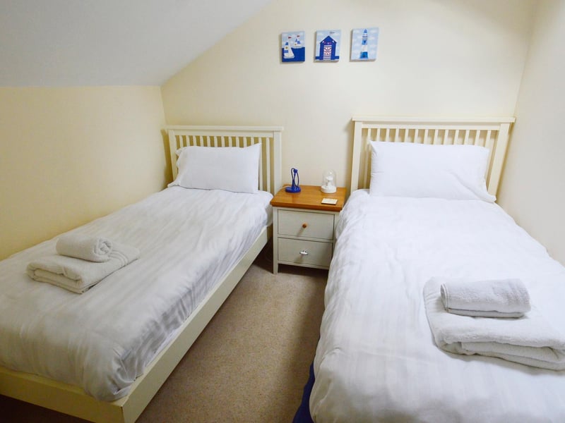One of the three first-floor bedrooms.