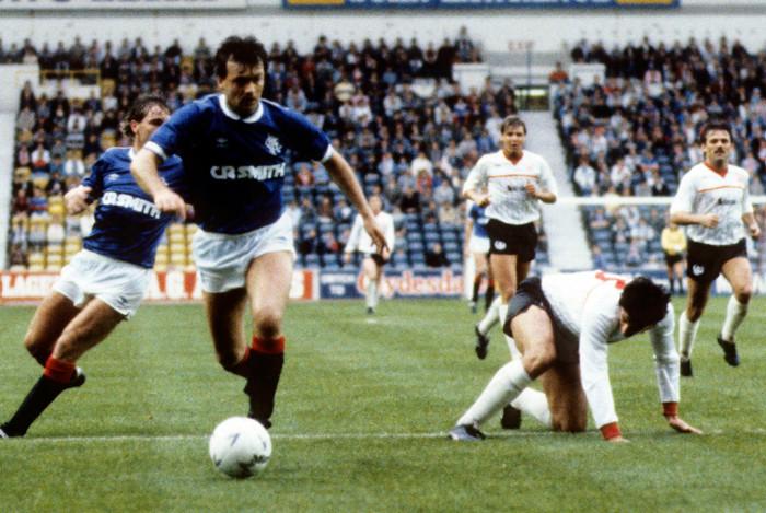 Glazing company became the first shirt sponsors in the mid-1980s, adding their glazing company name to the front of the shirts along with manufacturers Umbro - as modelled by Davie Cooper against Clyde in 1985.