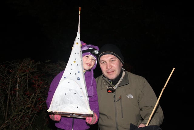 Youngster Francesca Stobbs and her father with the lantern she had made for Whaley Bridge's lantern parade before the town's bonfire  in 2013
