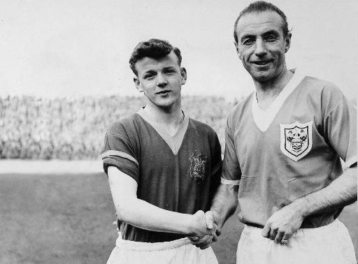 Billy Bremner shakes hands with Stanley Matthews ahead of a League Cup tie.