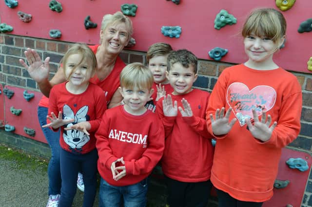 Children at Tibshelf Infant School are wearing red on Friday to show racism the red card.