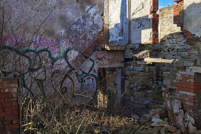 The old farmhouse has been graffitied throughout the years.
