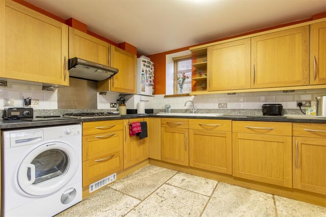 In keeping with the name of the property, the house has a farmhouse-style kitchen with solid oak cupboards and drawers. A washing machine, dishwasher, electric oven and four-ring gas hob with extractor hood are integrated appliances. There is space to accommodate a tumble dryer and fridge/freezer.