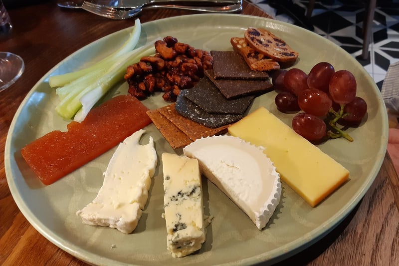 Local cheese board with artisan biscuits, walnuts, grapes, celery, and a quince chutney, £11.50