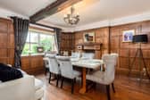 The stunning dining room is finished with wainscot pannelling and original period features throughout, giving the room charm and character.