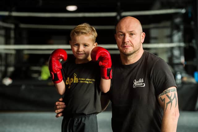 Boxer Caden James, 5, pictured with dad Stuart. (Photo: SWNS).