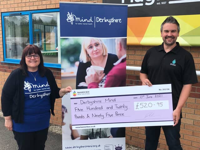 Debbie Locke from Derbyshire Mind accepts a cheque from Banner Box Print Solutions director Ryan Shelton.