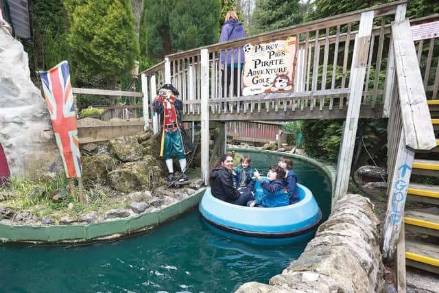 A family having fun on the Gully's Pirate Adventure ride at Gulliver’s Kingdom.