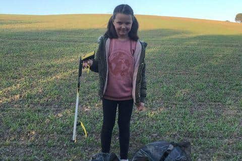 Isla Hutchinson, eight, has been clearing litter around Tupton Hall School and in North Wingfield