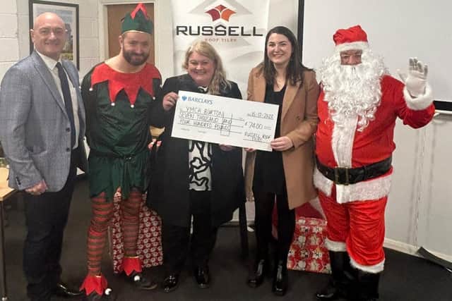 YMCA Burton receiving charity donation from Russell Roof Tiles