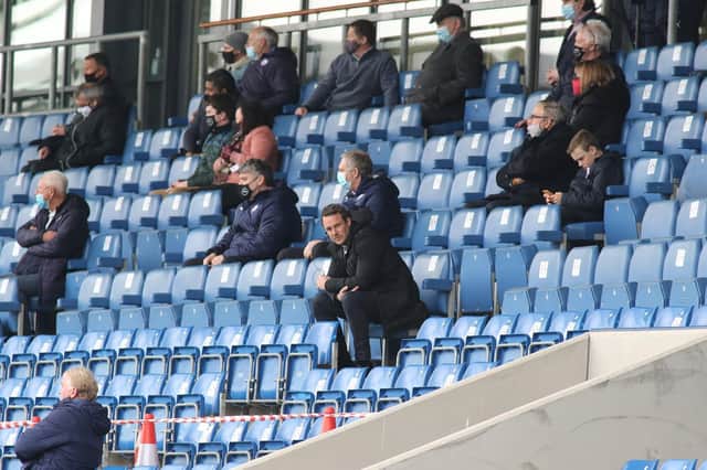 James Rowe had to sit in the stands after receiving a four-match touchline ban.